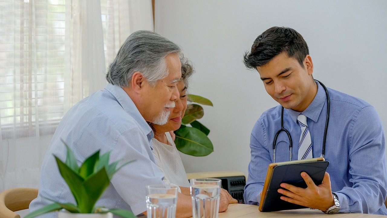 Doctor discussing health concerns with an older couple